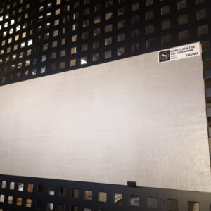 Porcelain tile display on black grid wall at Jerry Kitchen.