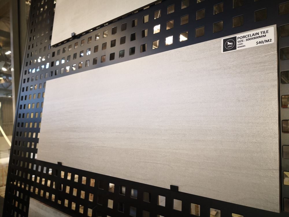 Porcelain tile display with price tag in a showroom.