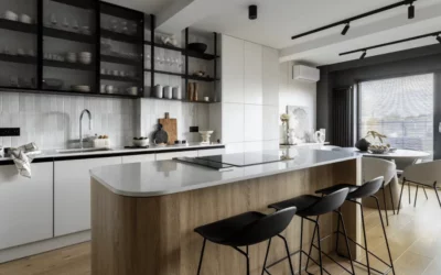 Modern kitchen with wood island, black open shelving, and minimalist white cabinets
